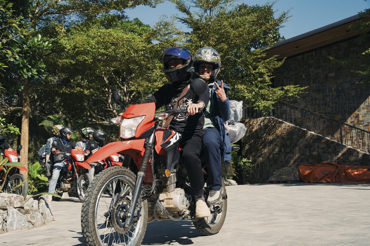An Easy Rider taking a rider pillion, with the rest of the group behind
