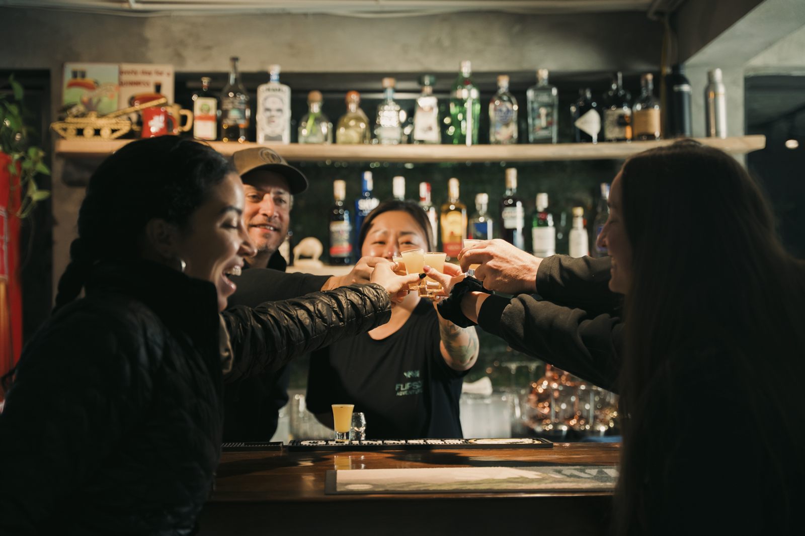 Group toasting at the bar