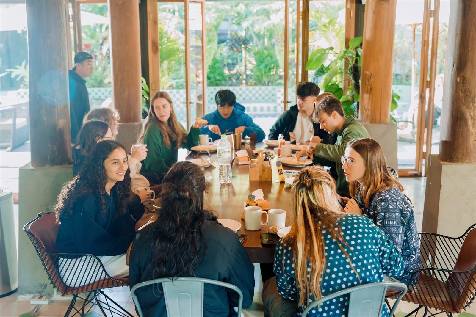 Long table of people at breakfast