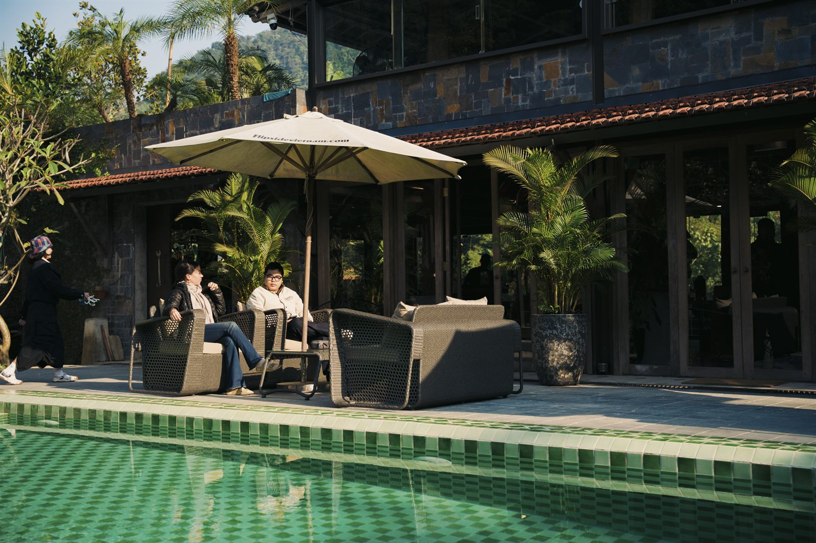 Shaded seating beside the pool