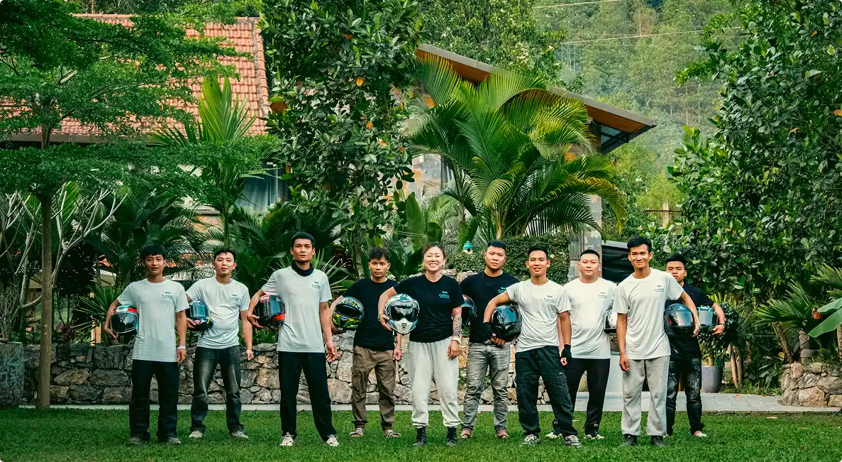 The Flipside crew outside the villa, holding their helmets