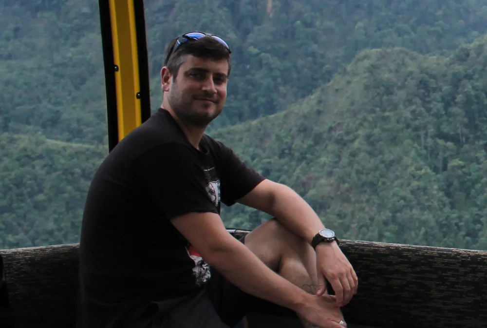 Tom in a gondola above the valley